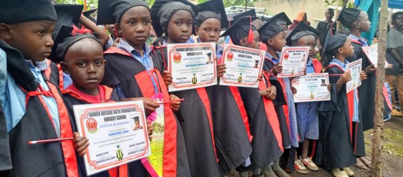 Students proudly displaying their certificates